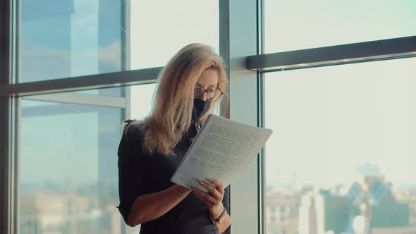 Office Manager Working On Workplace. Lawyer Employee In Glasses Reading Market Data Documents.