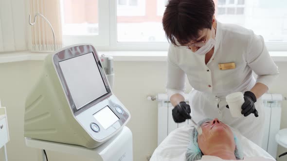 Woman Receiving HUFU Therapy High Intensity Focused Ultrasound Treatment on Face