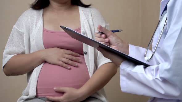 Pregnant Woman and Gynecologist Doctor at Hospital