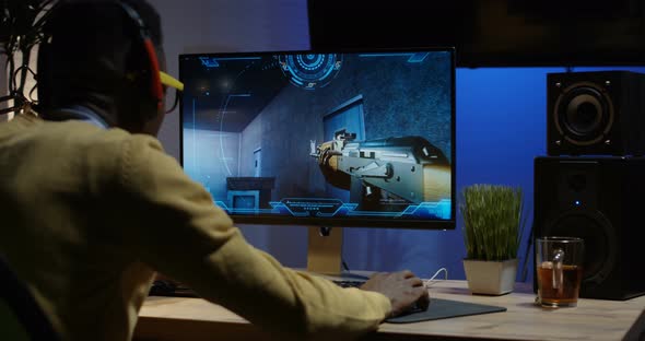 Young Man Playing Video Game Inside a Room