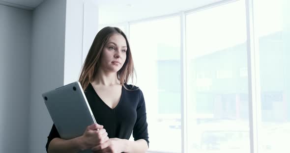 Young Business Woman Walking in Office Hall Corridor. Serious Attractive Female Goes To Conference