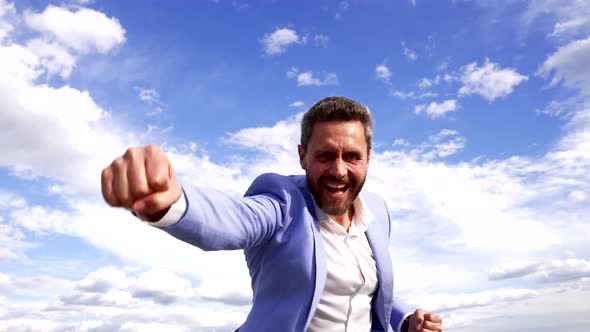 Happy Successful Businessman Scream Making Winning Gesture on Sky Success