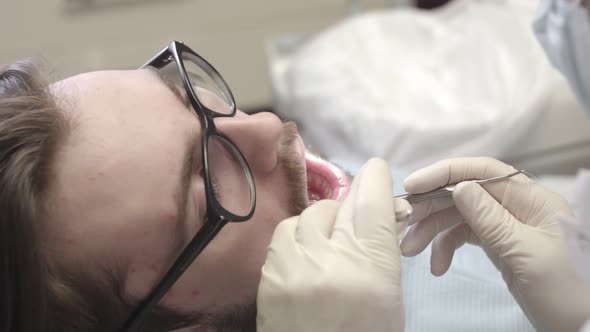 Man at the reception at the dentist