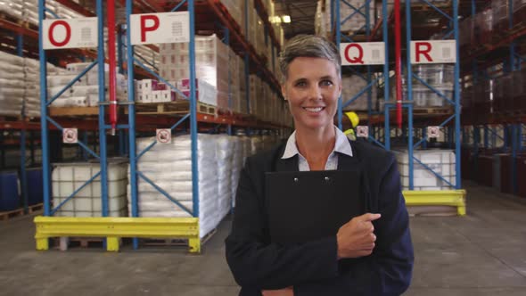 Portrait of a female warehouse manager at work 4k