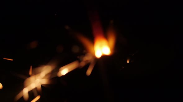 Sparkler Burning Against Black Background