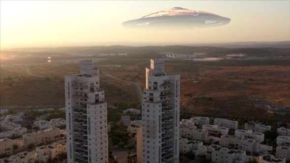 Ufo flying saucer Close to City at Golden Hour- Aerial 