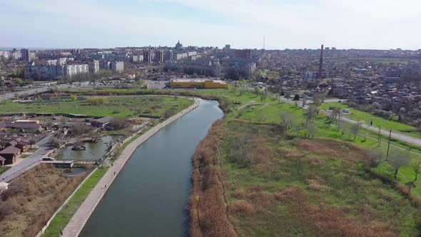 A bird's eye view of the city. You can see the buildings and the river.