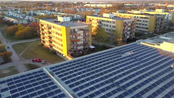 Solar power panels on top of residential building roof for producing of green ecological electricity