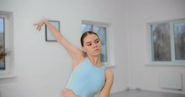 Dancer Warms Up Before Rehearsal in the White Bright Dance Hall, Ballet Rehearsal, Ballerina 