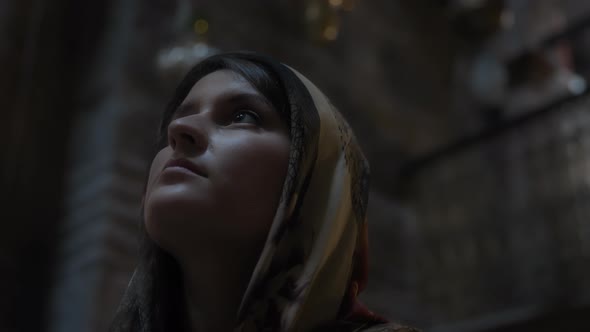 Woman looking up inside the church