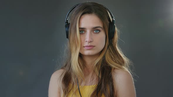 Studio Portrait Gray Background Young Beautiful Serious Girl Student Wears Headphones on Head