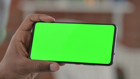 Holding Green Chroma Key Smartphone Screen Horizontal