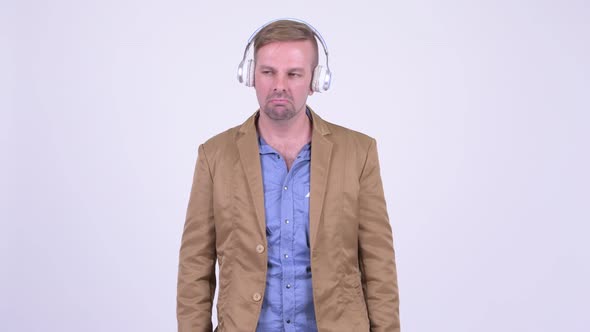 Happy Blonde Casual Businessman Dancing and Listening To Music