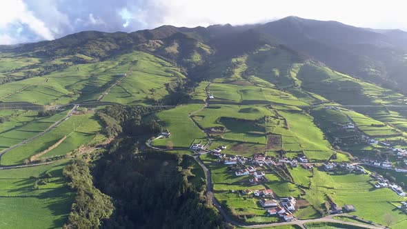 Flying Over a Village on the Green Portuguese Sao Miguel Island in the Azores