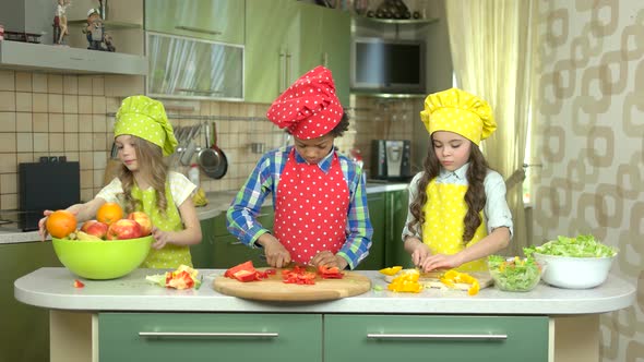 Three Children in the Kitchen.