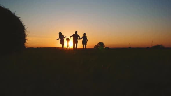 Family Silhouette with Sunset