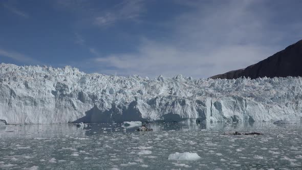 Melting glacier in Antarctica. Landscape of snowy mountains and icy shores in Antarctica.