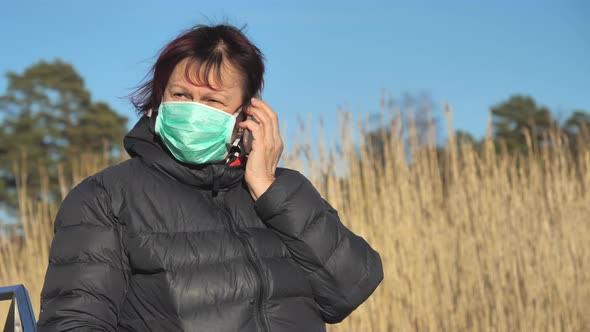 A Lady Talking Someone Over the Phone in Finland