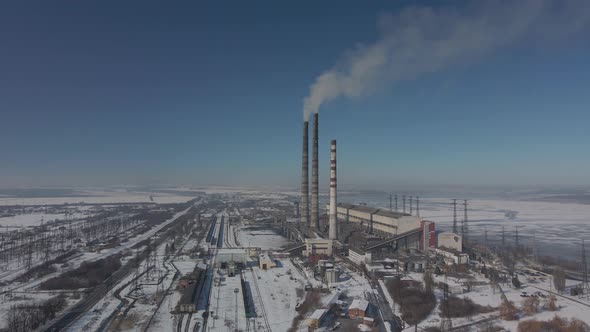 Aerial View of High Chimney Pipes with Grey Smoke From Coal Power Plant