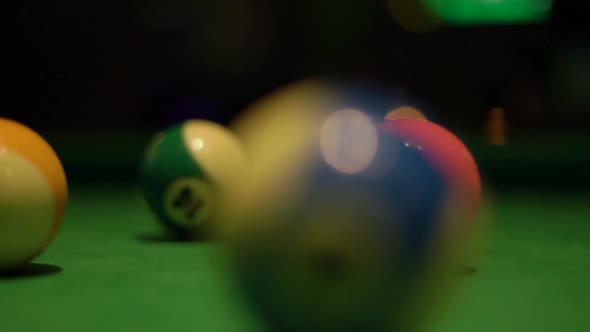 Motion Past Balls on Pool Table Covered with Green Fabric