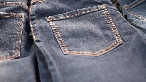 Jeans and Underpants Pile Up on a Shelf