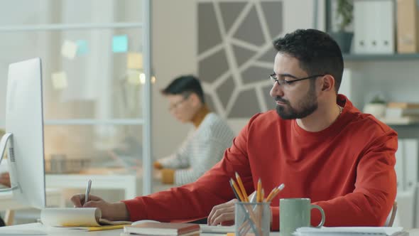 Businessman Working at Desk in Office