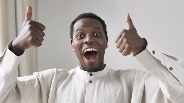 Excited AfricanAmerican Guy Shows Thumbs Up and OK Gestures