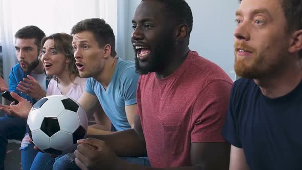 Group of Friends Watching Football on Tv, Roaring Approval After Scored Goal