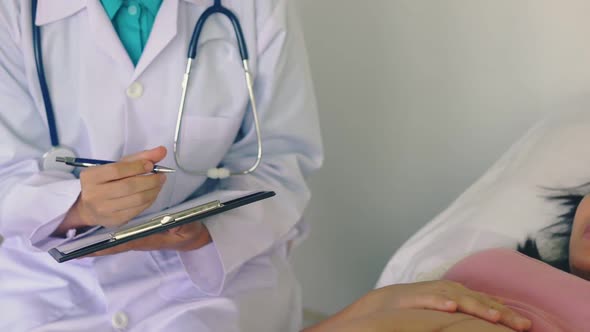 Pregnant Woman and Gynecologist Doctor at Hospital