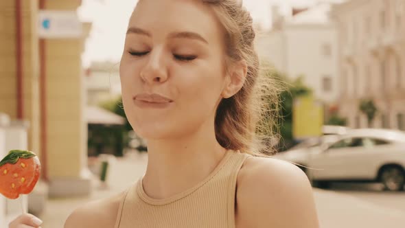 Portrait of beautiful cute model in summer clothes posing outdoors