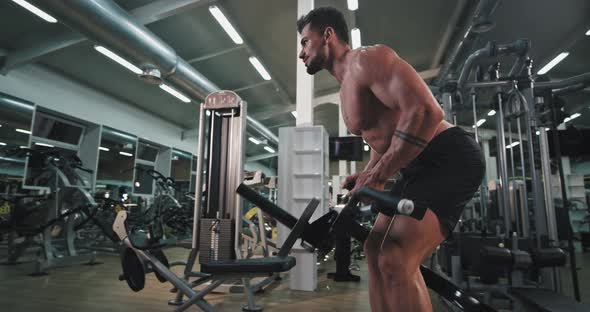 Tired and Attractive Athletic Guy Working Well in