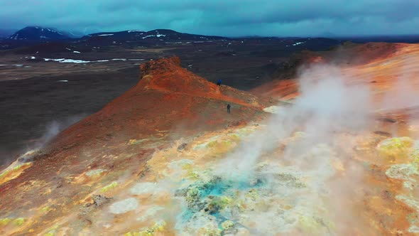 Man Walks On Mars Formations in The Hverir Geothermal Area Near Lake Myvatn