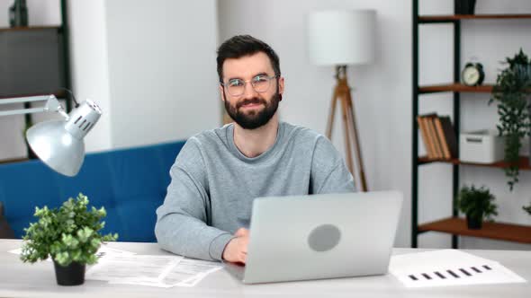 Portrait Modern Bearded Smiling European Business Man Posing at Comfortable Office Workplace Laptop