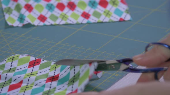 Hand cutting a plaid fabric