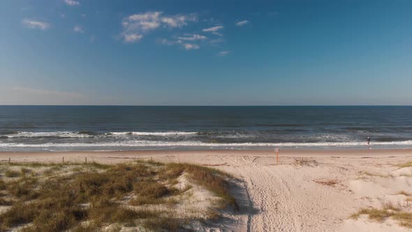 4k footage of beach on Oak Island NC mid-morning