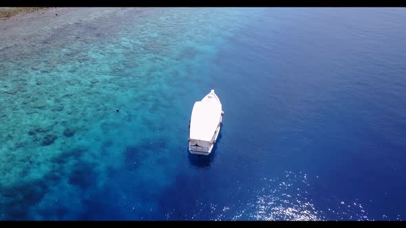 Aerial top view landscape of beautiful coastline beach trip by blue sea with white sandy background 