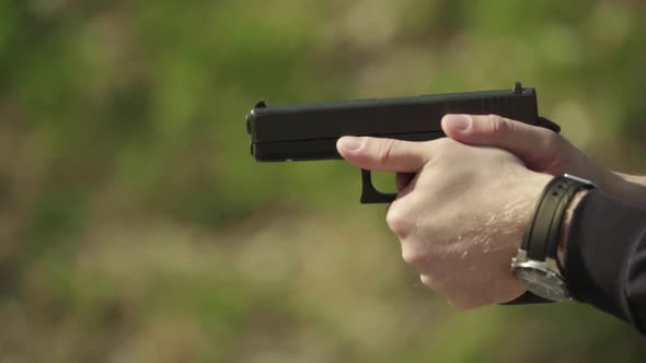 Close-up Shot of a Pistol. Slow Motion.