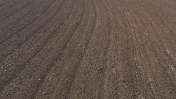 Agricultural soil ready for spring works 4K aerial video