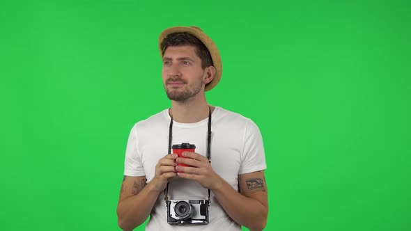 Portrait of Confident Guy Is Enjoying Coffee. Green Screen