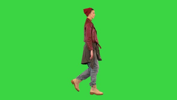 Young Girl in a Leather Jacket Walking on a Green Screen Chroma Key