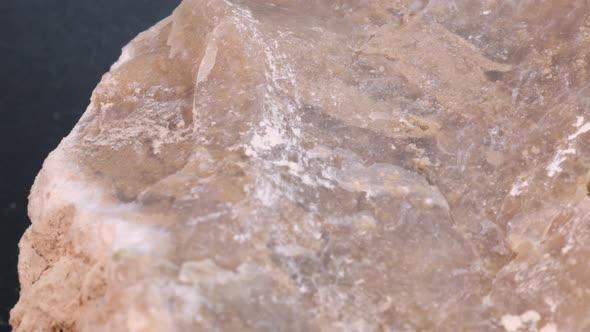 Prehistoric flint stone macro shot with rotating motion, very close up view. Studio quality 4k scien