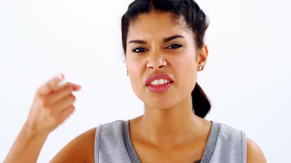 Woman gesturing while talking against white background 4k