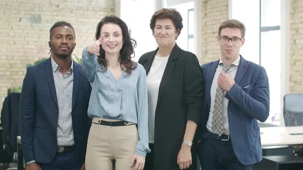 Group of Multiracial Coworkers Posing in Office. Positive Confident African American and Caucasian