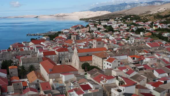 Church Of The Assumption of St.Mary And Residential Houses In Pag Island, Croatia. - aerial