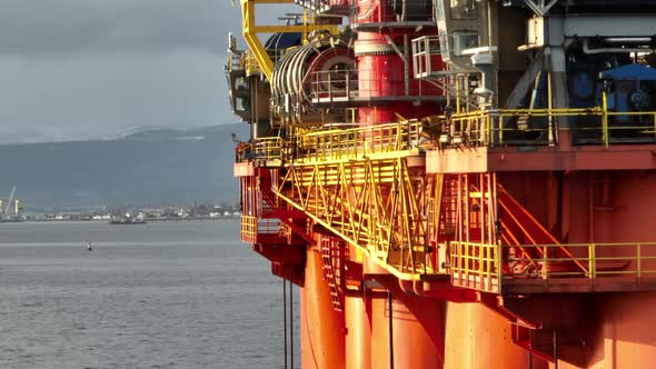 Oil and Gas Rigs Seen up Close at Sunset
