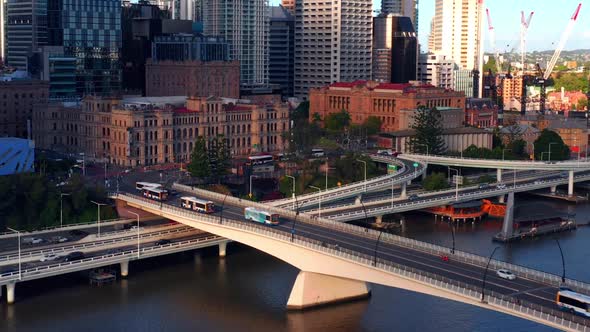 Traffic And Articulated Buses Driving Across Victoria Bridge Over Brisbane River In Queensland, Aust