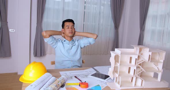 Relaxing Young Architect Man With An Architectural Project