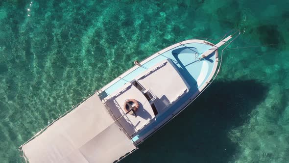 Aerial View of White Boat on Turquoise Sea Water