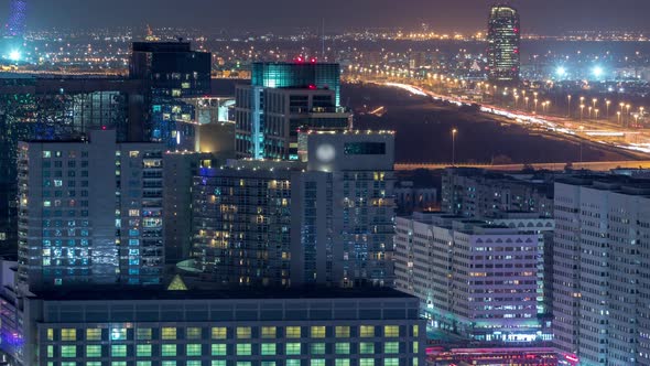 Aerial Skyline of Abu Dhabi City Centre From Above Night Timelapse