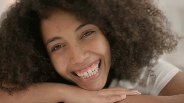 Close Up of Young African Woman Smiling at Camera